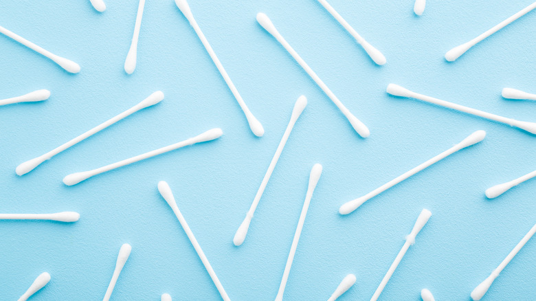 cotton swabs on blue background