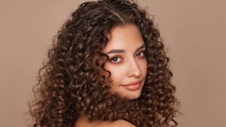 Woman brown bouncy curls