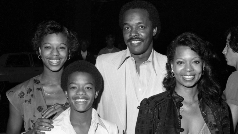 Todd, Verda, Betty, and James Bridges smiling in a 1980s photo.