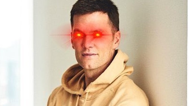 Tom Brady is seen with red laser eyes.