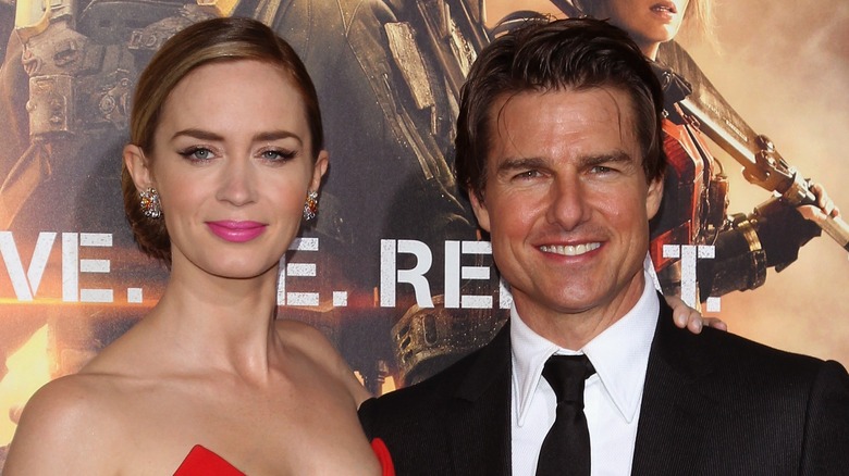 Emily Blunt and Tom Cruise posing together