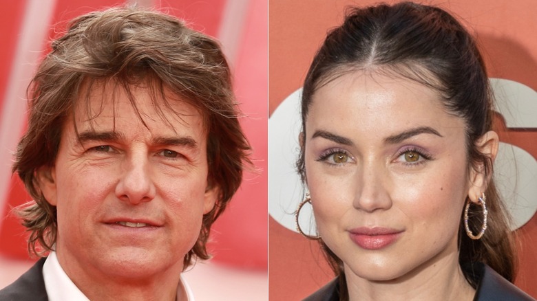 Tom Cruise smiling in a black suit while Ana de Armas poses in light dress.