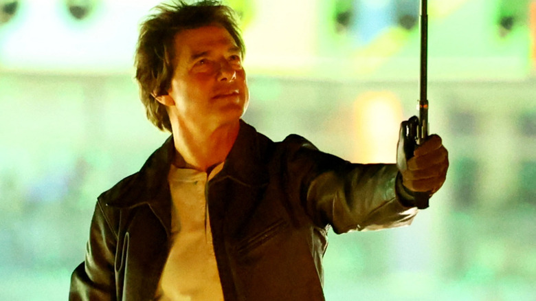 Tom Cruise holding a selfie stick