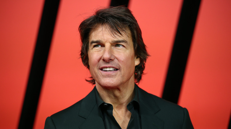 Tom Cruise looking into the distance at a movie premiere