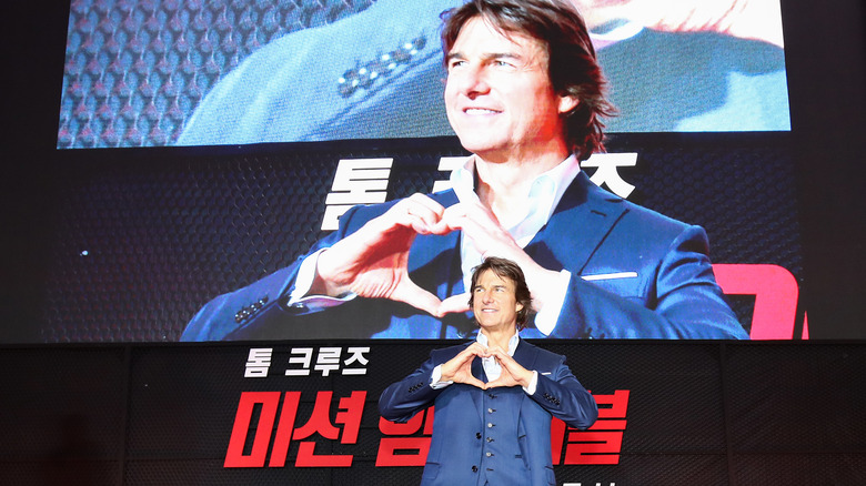 Tom Cruise making heart gesture in South Korea