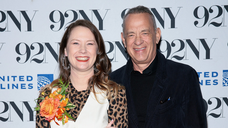 E.A. Hanks and Tom Hanks smiling and posing.
