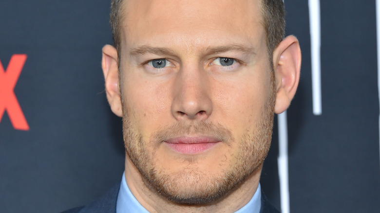 Tom Hopper posing at event