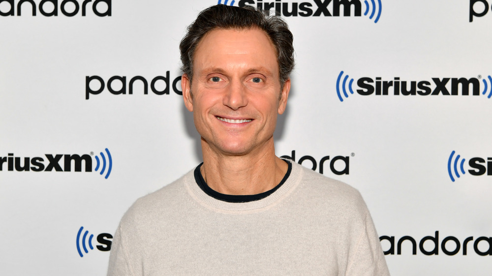 Tony Goldwyn smiles facing forward