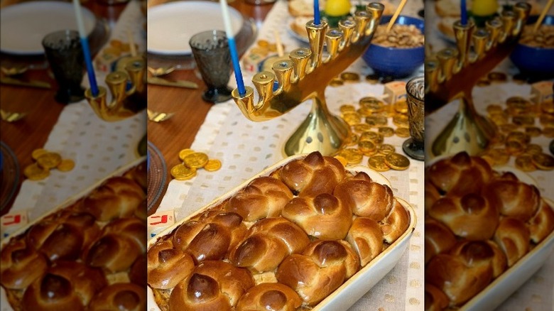 Challah and menorah on table