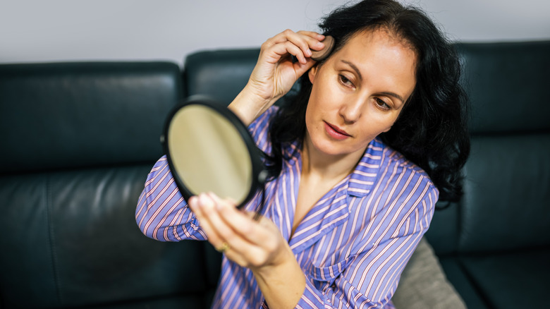 Woman applying root touch-up powder