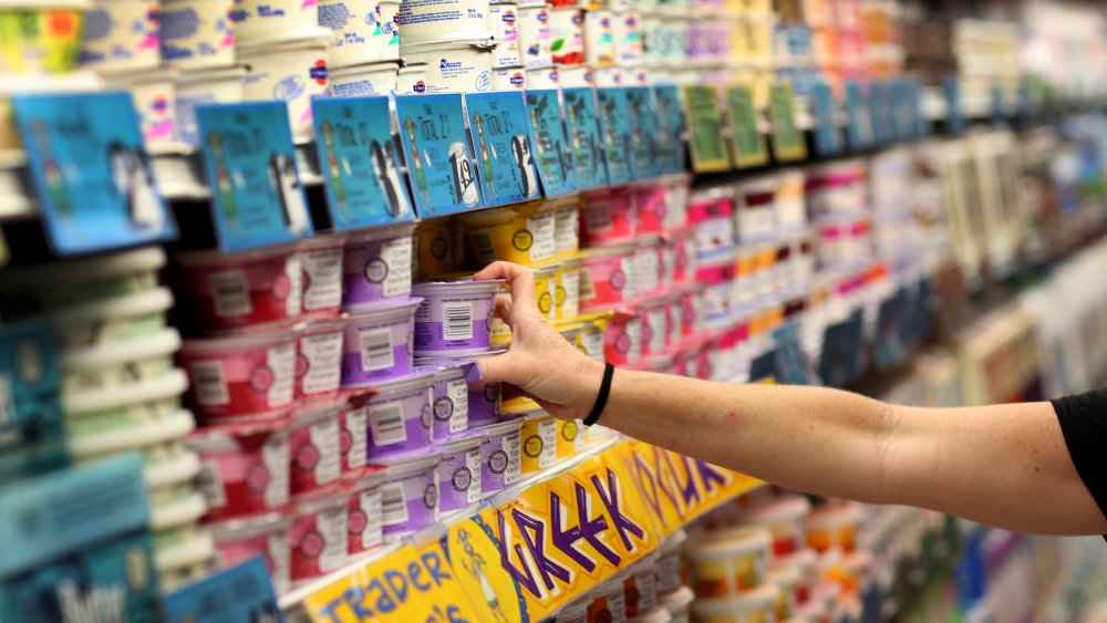 Person choosing yogurt
