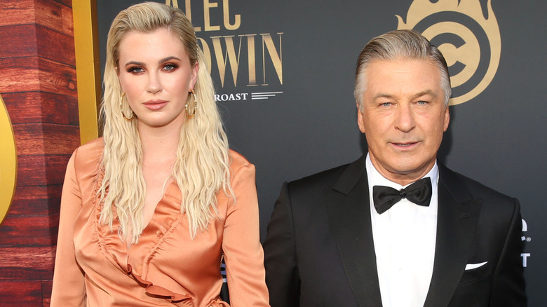 Ireland Baldwin standing with Alec Baldwin