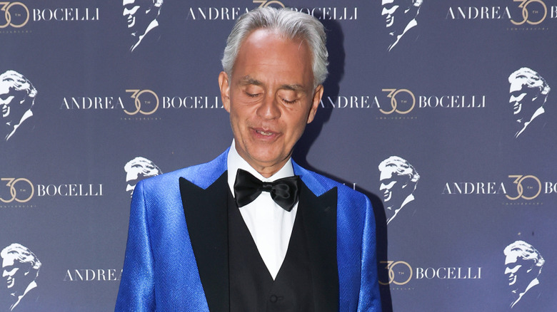 Andrea Bocelli posing on a red carpet