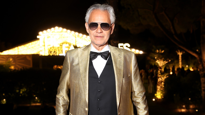 Andrea Bocelli in a gold suit