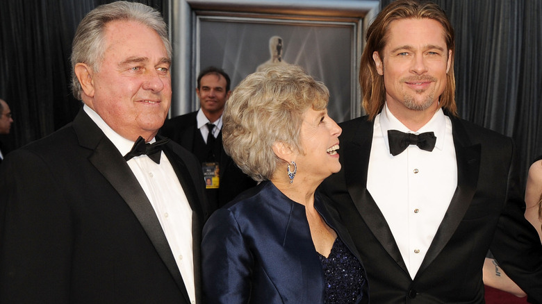 Brad Pitt and his parents waist-up on red carpet