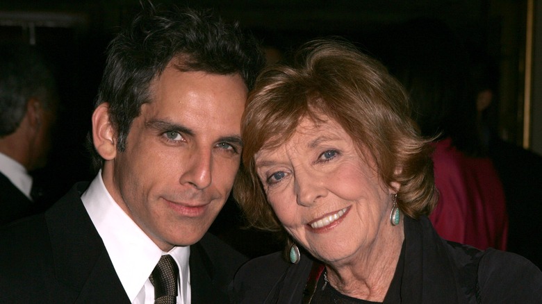 Ben Stiller smiling alongside his mother Anne Meara in a suit