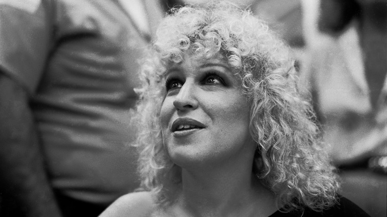 Black and white photo of Bette Midler with blonde curls.