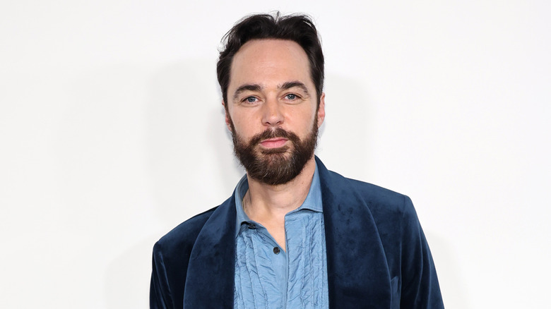 Closeup of Jim Parsons posing on step-and-repeat