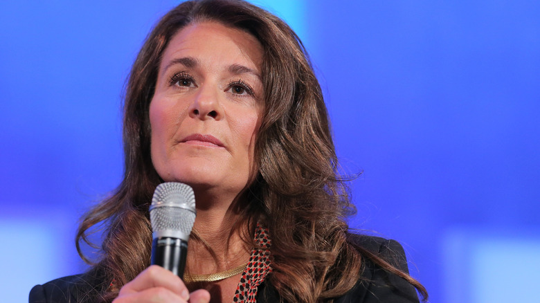 Melinda French Gates holding a mic at a speaking event