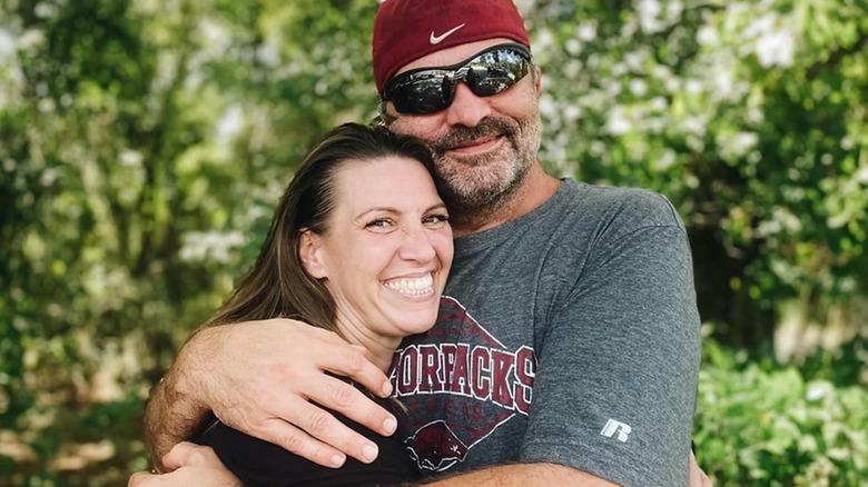 Amanda Brumfield and her husband embracing