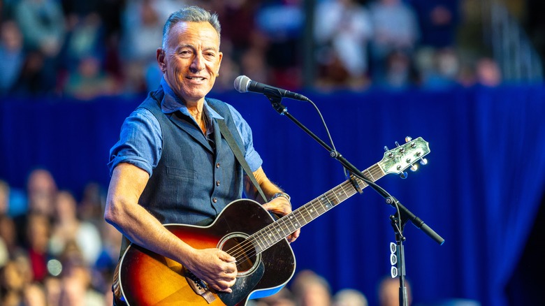Bruce Springsteen playing a guitar