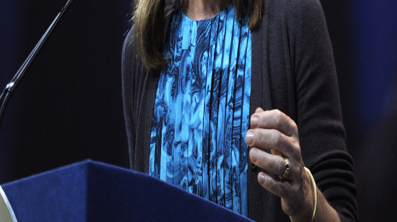 Caroline Kennedy delivering a speech in front of a blue background