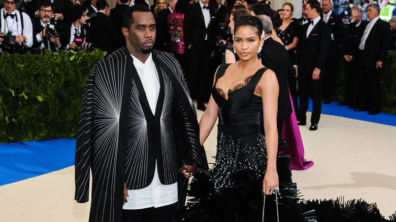 Cassie Ventura and Sean Combs posing for photos