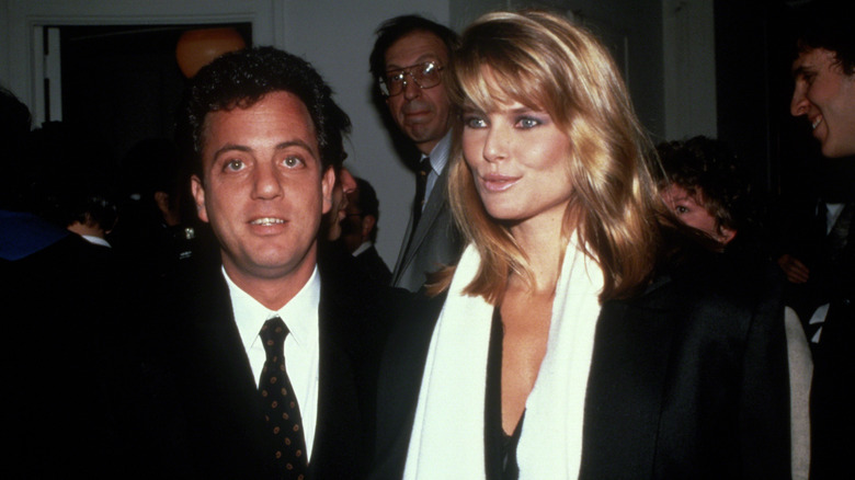 Christie Brinkley and Billy Joel posing for photos