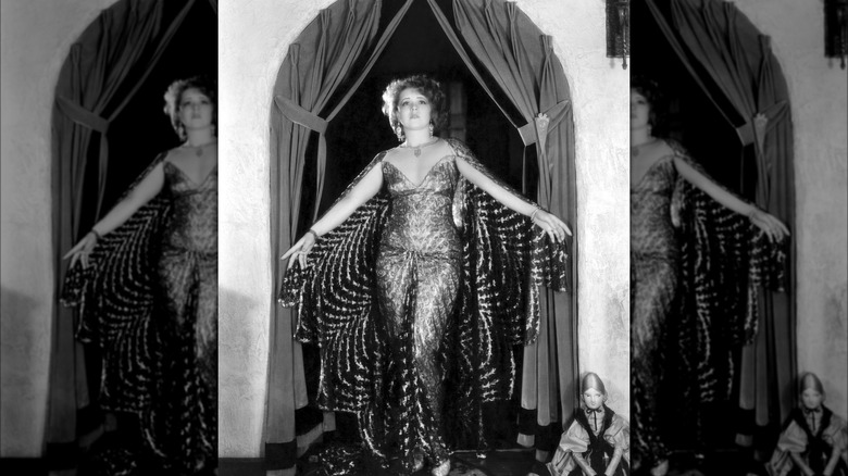 Clara Bow posing in an elaborate gown
