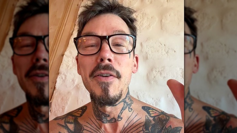 David Bromstad with glasses neck and shoulder tattoos visible