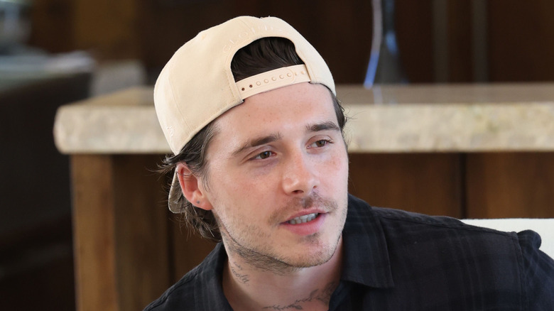 Close-up of Brooklyn Peltz Beckham mid-conversation