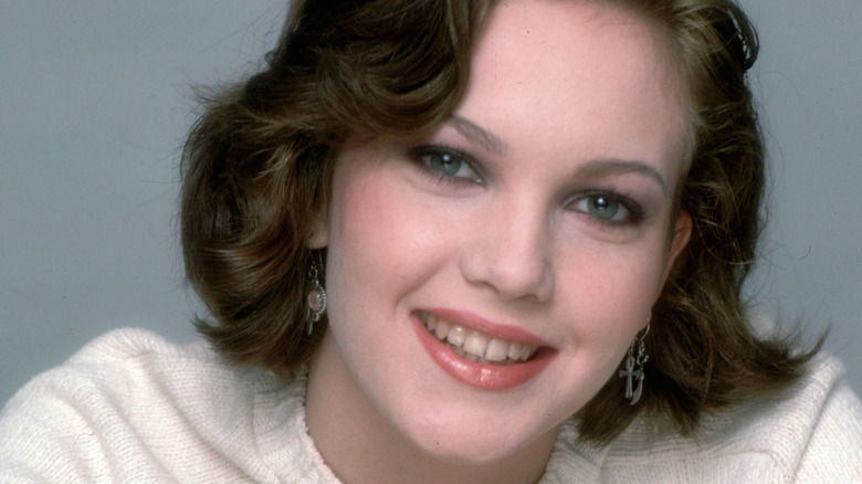 A young Diane Lane smiling for a photo
