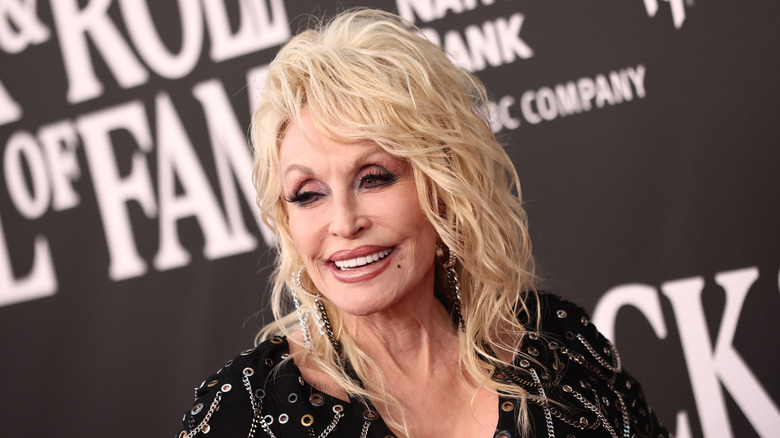 Dolly Parton smiling in a black dress.