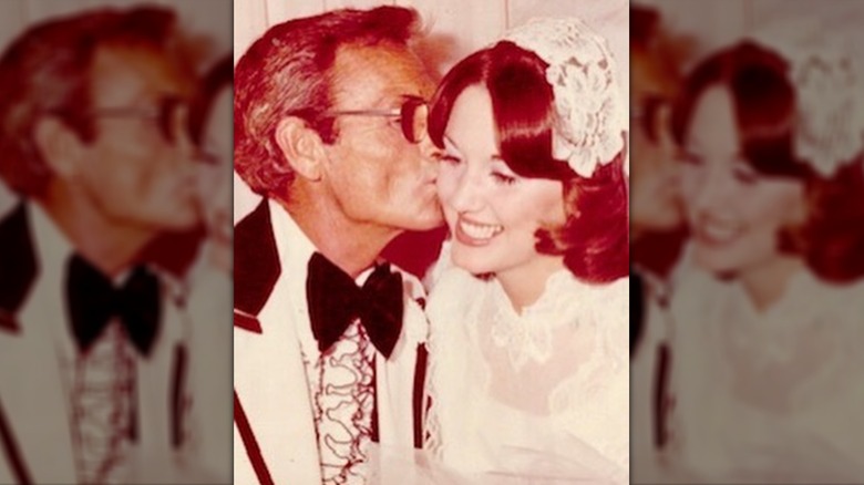 Robin McGraw's father kissing her on the cheek on her wedding day