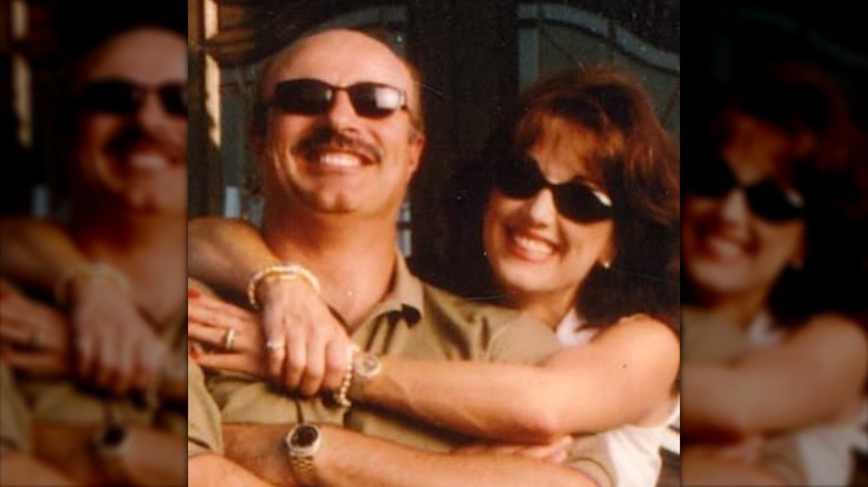 A young Robin McGraw and Dr. Phil smiling wearing sunglasses