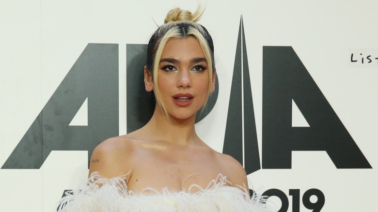 Dua Lipa posing on the red carpet at ARIA awards