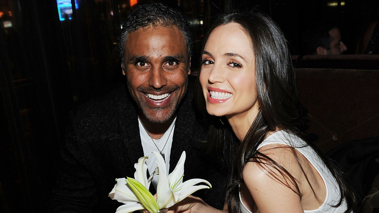 Rick Fox and Eliza Dushku smiling at the Lily Bar & Lounge grand opening in 2012