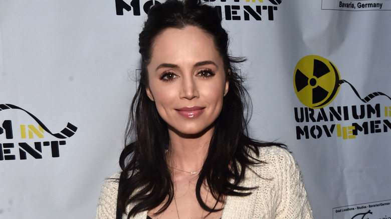 Eliza Dushku smiling at a premiere event for The Man Who Saved the World in 2016