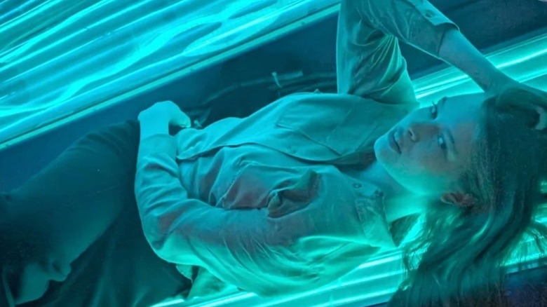 Vivian Wilson laying in a tanning bed