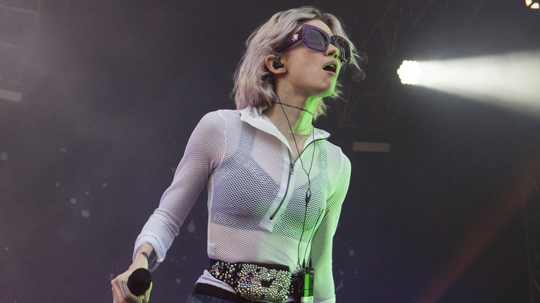 Grimes performing at a concert