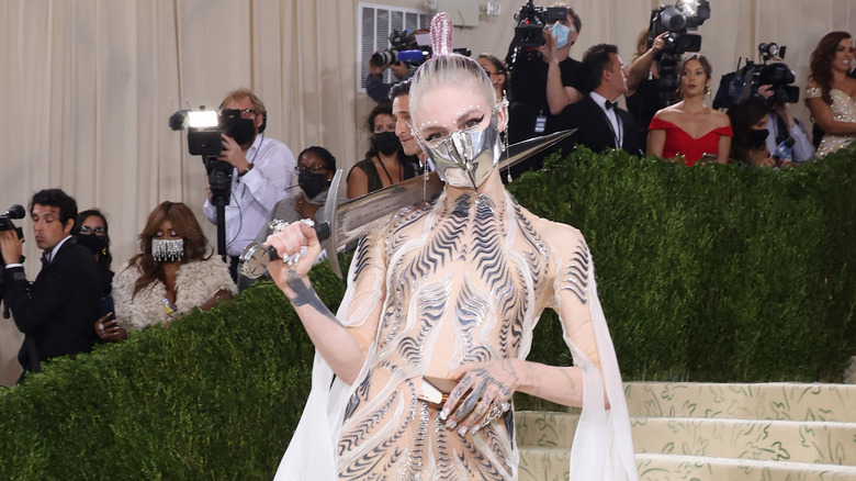 Grimes posing for photos