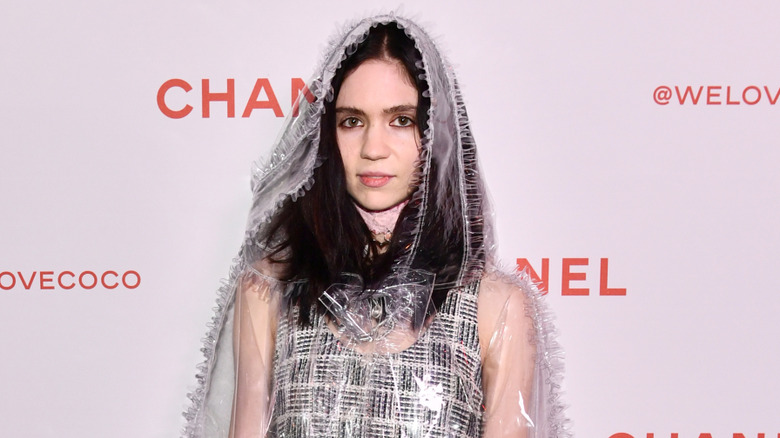 Grimes posing for photos