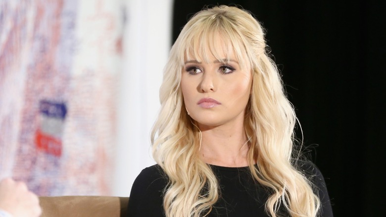 Tomi Lahren with a serious expression