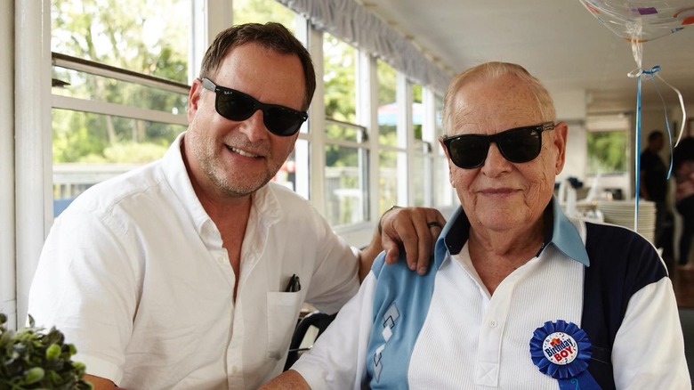 Dave Coulier sitting and smiling with his father