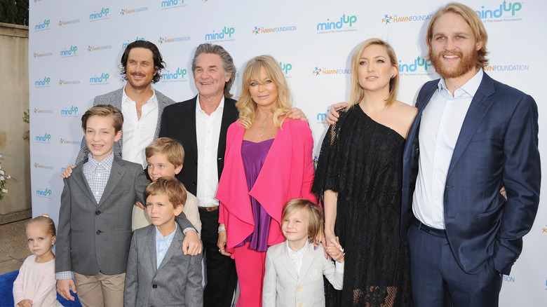 Goldie Hawn posing with Kurt Russell, her kids, and grandkids at charity event