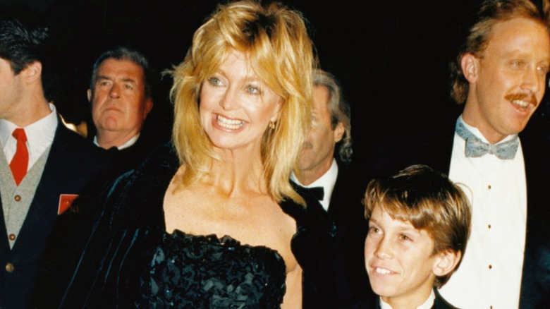 Goldie Hawn on a red carpet with a young Oliver Hudson