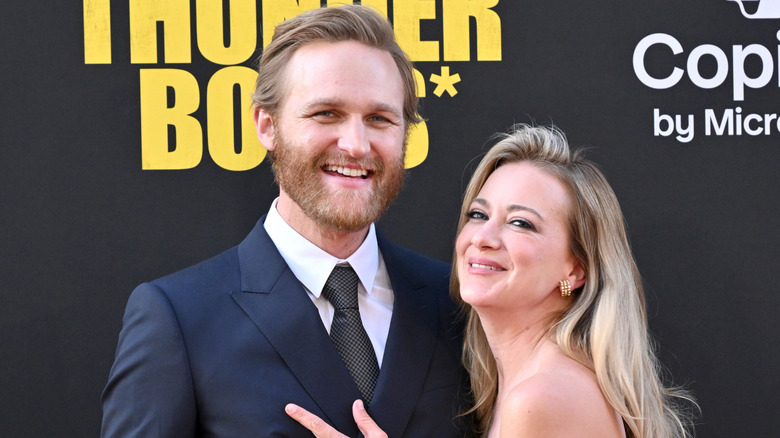 Wyatt Russell and Meredith Hagner posing on a red carpet