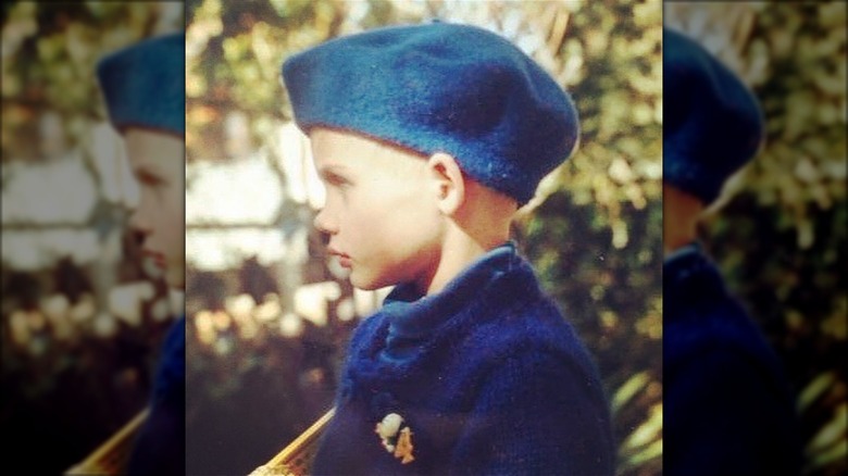 Toddler Clare Bowen with bald head under hat