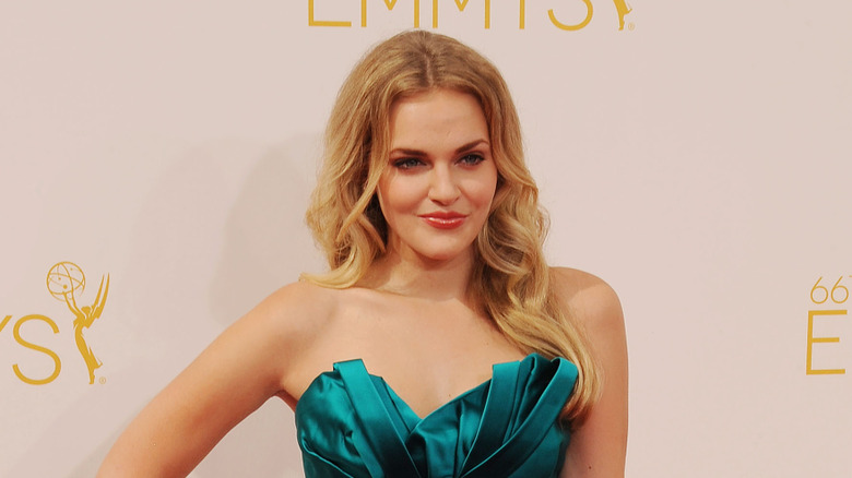 Madeline Brewer posing in a teal dress at the Emmys