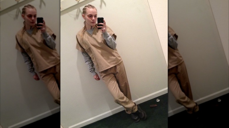 Madeline Brewer in costume on set of "Orange is the New Black" taking a selfie
